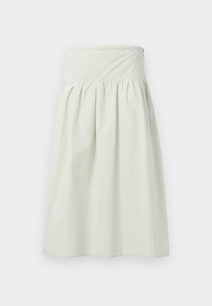 Svetlo bež krilo, izdelano iz mehke in lahke tkanine. Ima visok elastičen pas, naborke in sproščen A-silhuet.