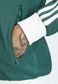 adidas Originals Majica s kapuljačom i patentnim zatvaračem - collegiate green