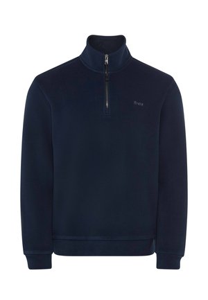 Pullover in pile navy con colletto alto, zip frontale a quarto, polsini a coste e un logo discreto. Texture liscia e vestibilità rilassata.