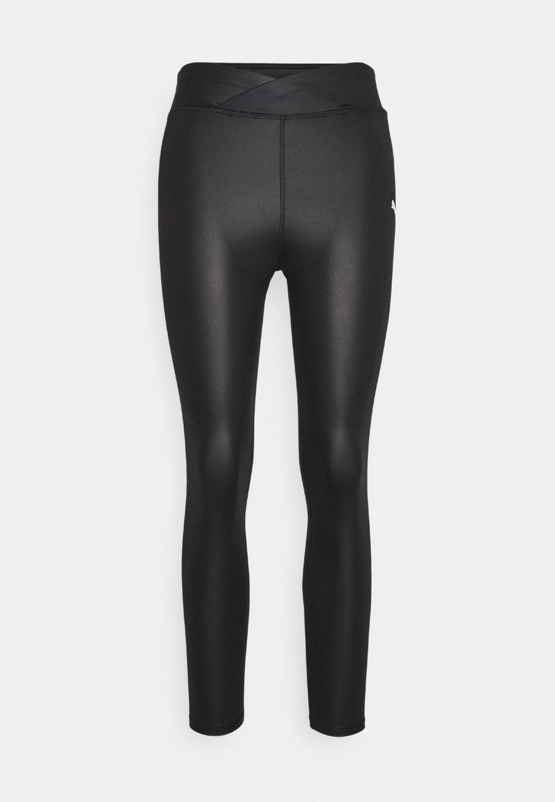 Černé sportovní legíny s vysokým, kříženým pasem, vyrobené z hladké, elastické tkaniny. Na horní části nohy se nachází malé logo.