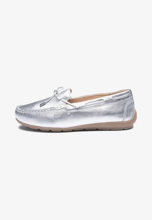 Silver leather slip-on moccasin with bow detail and beige rubber sole, shown in side profile on white background.