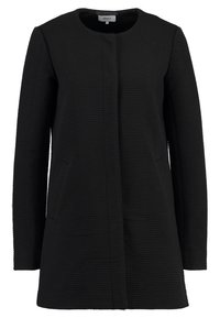Abrigo negro texturizado con escote redondo, mangas largas y dos bolsillos frontales. Diseño simple y recto sin cierres visibles.