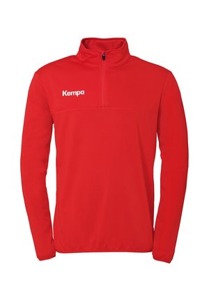 Red fleece sweatshirt with a quarter zipper and high collar; features white "Kempa" logo on the left side. Smooth texture, long sleeves.