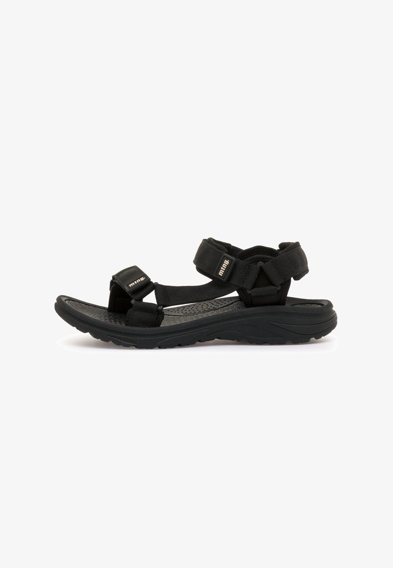 Schwarze Sandalen mit verstellbaren Riemen, strukturiertem Fußbett, stabiler Gummisohle und einer geschwungenen Form für Komfort und Halt.