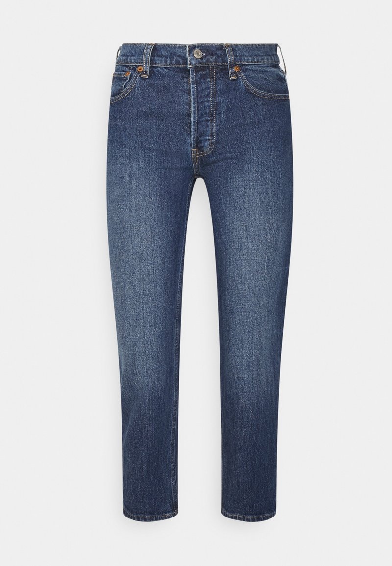 Jean droit en denim bleu avec taille haute, fermeture par bouton et zip, poches avant et arrière.