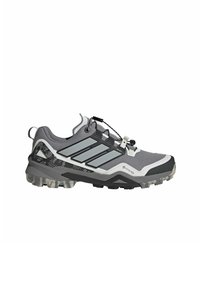 Gray and black outdoor shoe featuring a textured upper, reflective accents, GORE-TEX branding, and a rugged rubber sole with traction.