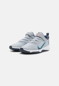 Gray athletic shoes with mesh upper, padded collar, and a strap; features pink and teal accents; rubber sole for grip.