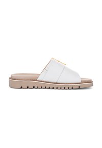 White slide sandal with cross-strap design, featuring a gold accent. The sole is textured with ridges, and the insole is beige.