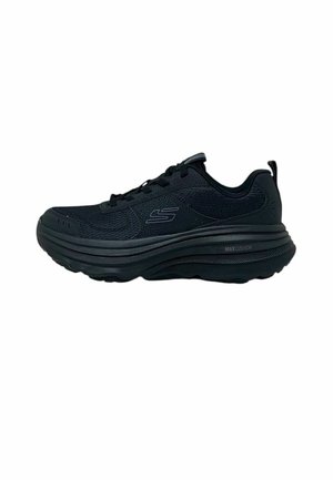 Scarpa sportiva nera Skechers con suola spessa imbottita e tomaia in mesh, mostrata di profilo su sfondo bianco.