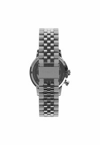Montre Timex en acier inoxydable avec une finition lisse et polie, présentant un cadran noir rond, un bracelet en métal et deux poussoirs sur le côté.