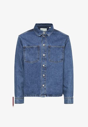 Denimu jaka ar gaiši zilu krāsu, klasisku apkakli, divām priekšējām kabatām, sudraba pogu aizdari un izšuvumiem.