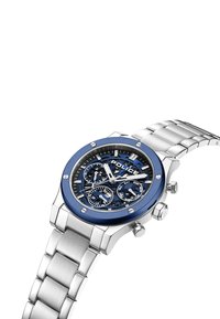 Orologio in acciaio inox argentato con un lunetta blu, quadrante nero e tre piccoli quadranti secondari. Presenta lancette luminescenti e un bracciale a maglie.