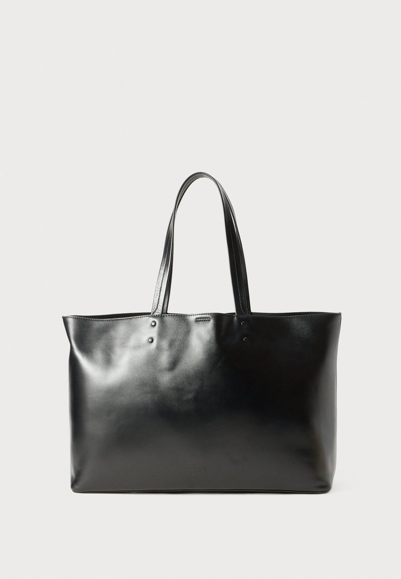 Black smooth leather tote bag with two shoulder straps, rectangular shape, and subtle stitching detail on a white background.