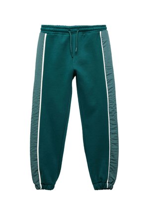 Türkise Sweatpants mit elastischem Bund, weißen Seitenstreifen und strukturierten grauen Stoffeinsätzen an den Seiten. Die Bündchen sind an den Knöcheln gerafft.