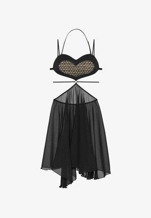 Czarna przezroczysta sukienka z koronkowym biustem w kształcie serca, cienkimi ramiączkami, wycięciem na brzuchu i asymetryczną, zwiewną spódnicą.
