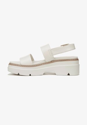 Sandales à plateforme blanches avec deux larges brides, une bride arrière et une semelle texturée pour une meilleure adhérence. Présente un design minimaliste et une finition lisse.