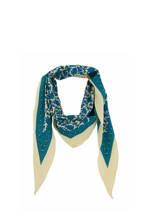 Écharpe triangulaire beige avec des motifs floraux bleus complexes et des motifs géométriques le long des bords, pliée en boucle lâche.