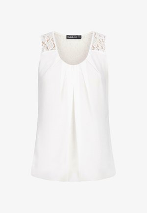 Haut sans manches blanc avec un col rond, un devant plissé et des accents en dentelle sur les épaules. Fabriqué en tissu léger et doux.