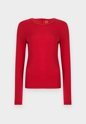 Rød langermet skjorte laget av myk bomull, med rund hals og tettsittende design. Jevn tekstur uten mønstre eller pynt.