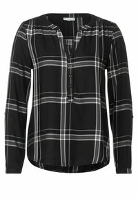 Blusa a quadri bianca e nera con maniche lunghe, scollatura a V e dettaglio di bottoni sul davanti. Tessuto morbido con orlo leggermente curvo nella parte inferiore.