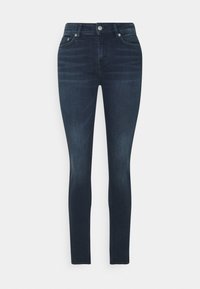 Skinny jeans in donkerblauwe denim, met een gladde textuur, vijfzakkenontwerp en zilveren hardware bij de tailleband en zakken.