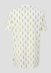 Witte T-shirt met korte mouwen, voorzien van een all-over print van groene en roze ananas. Gemaakt van katoen met een zachte textuur.