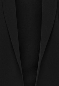 Black blazer with a smooth fabric texture, featuring a notched lapel design and a fitted silhouette. No visible fastenings or embellishments.