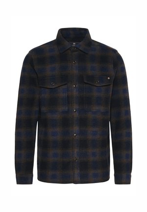 Tumši zilas un brūnas svītru raksta flaneles krekls. Iekļauj divas krūšu kabatas ar atloku un snap pogām, garām piedurknēm un apkakli.