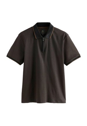 Brown polo shirt with a textured pattern, black collar, and zip closure. Features contrasting stitching along the collar and sleeves.