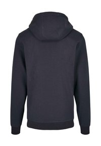 Svart hoodie med en avslappnad passform, som har en slät yta, ribbade ärmslut och nederkant, utan synliga logotyper eller mönster.
