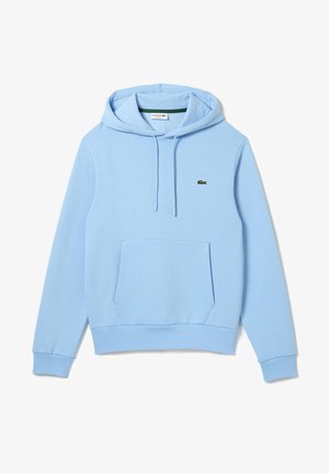 Sweat à capuche bleu clair avec poche frontale, cordons de serrage et petit logo de crocodile vert sur la poitrine gauche. Aucune personne présente.