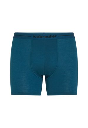 Teal boxer shorts laget av mykt materiale. Har en svart elastisk midje med "icebreaker" merkevare og en figursydd design.