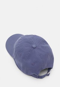 Cotton baseball cap in dark purple. Curved brim, adjustable back strap, and stitched ventilation holes for breathability. Soft texture.