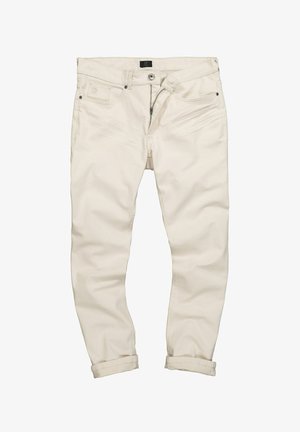 Jasnokremowe dżinsy o gładkiej fakturze, slim fit, pięć kieszeni, zapięcie na guzik i zamek błyskawiczny oraz podwinięte mankiety. Posiadają subtelne przetarcia na materiale.