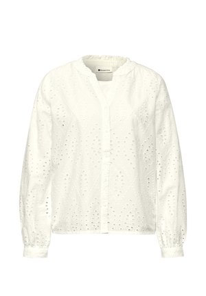 Blouse blanche à manches longues avec motif en dentelle à œillets, boutonnée devant, poignets élastiques et col légèrement froncé, marquée "Street One" à l'intérieur.