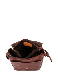 Brown leather crossbody bag open to show multiple interior compartments and a front pocket with a button closure.
