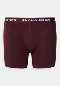 Boxer in borgogna con design aderente, texture morbida e una fascia nera a contrasto con la scritta "JACK & JONES" in lettere bianche.