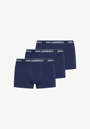 Trois boxers pour hommes bleu marine avec taille noire arborant le texte blanc "KARL LAGERFELD", alignés côte à côte sur un fond blanc.