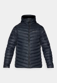Námořnická puffer bunda s vysokým límcem, zipovým zapínáním a diagonálním prošíváním. Obsahuje značkování na levé části hrudi.