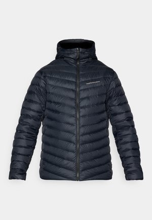 Navy puffer jacket with a high collar, zip closure, and diagonal quilted pattern. Features branding on the left chest area.