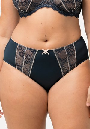 Culotte haute bleu marine avec des panneaux en dentelle chair, des bords festonnés et un petit nœud au centre devant, avec des coutures décoratives.