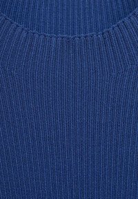Navy blue knitted sweater with a ribbed texture and a rounded neckline, featuring vertical lines and a soft, stretchy material.