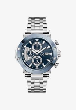 Strieborné kovové chronografové hodinky s modrým ciferníkom, tromi subčíselníkmi, okienkom s dátumom na tretej hodine a náramkom so spojkami.