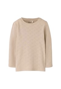 Długi beżowy top z długim rękawem, ozdobiony teksturowanym wzorem drobnych serduszek. Okrągły dekolt, miękki dzianinowy materiał oraz prosty krój bez widocznych zapięć.