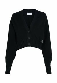 Černý zkrácený kardigán vyrobený z vroubkované pleteniny, s výstřihem do V, čtyřmi knoflíky a malou nášivkou s logem na přední straně.