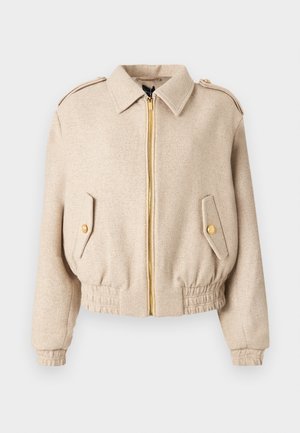 Beige bomber jacket with a gold zipper, gold buttoned pockets, elastic waistband, and shoulder epaulettes. Textured fabric with a soft finish.