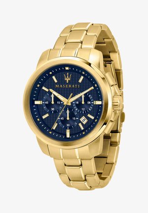 Goldfarbene Edelstahl-Uhr mit blauem strukturiertem Zifferblatt, drei Zusatzanzeigen, Datumsanzeige und auffälligen Stundenmarkierungen. Mit einem Gliederarmband.