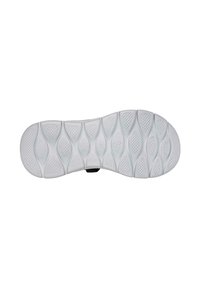 Suela de zapato blanca de goma con un patrón texturizado en zigzag y surcos en forma de óvalo para tracción, además de un detalle central con el logo.