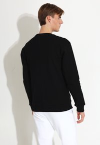 Carlheim UNIVERSAL NOEL COMFORT - Sweatshirt - black