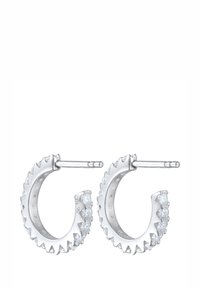 Sølv hoops øreringe med en takkede kant, der har klare ædelstene langs den ene side og en glat inderside. Beslag til sikker bæring.